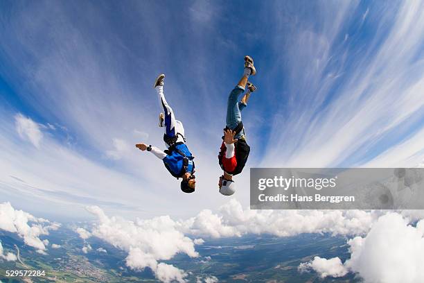 young couple upside-down in air - northern european descent stockfoto's en -beelden