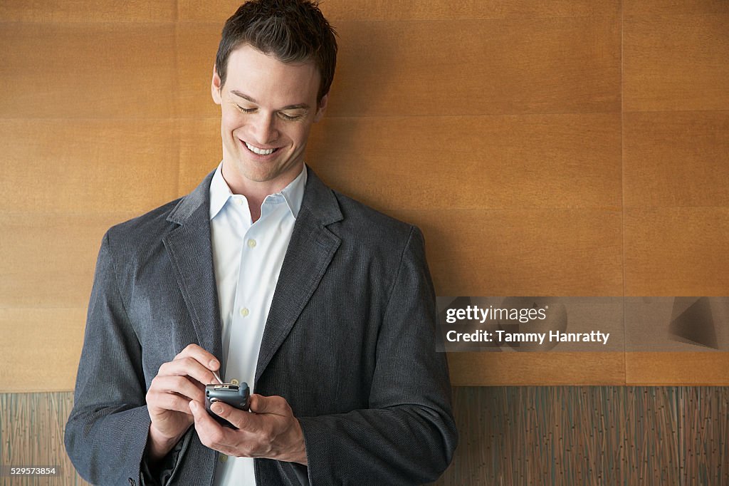 Businessman using PDA