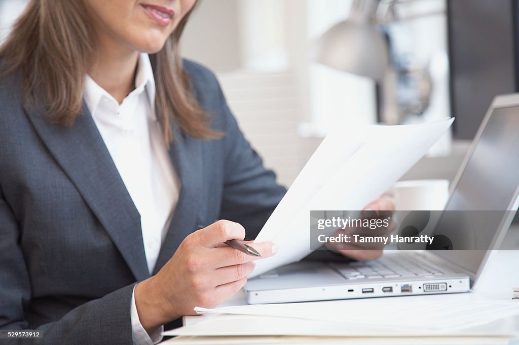 Businesswoman looking at document