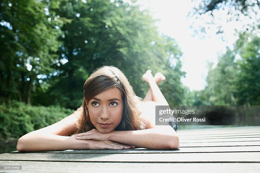 Woman Resting on Dock