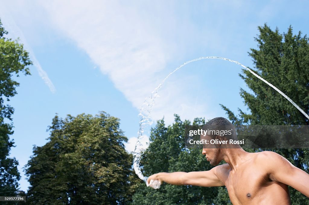 Man Squirting Water with His Hands