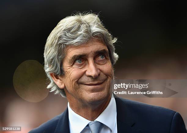 Manuel Pellegrini of Manchester City looks on during the Barclays Premier League match between Manchester City and Arsenal at the Etihad Stadium on...