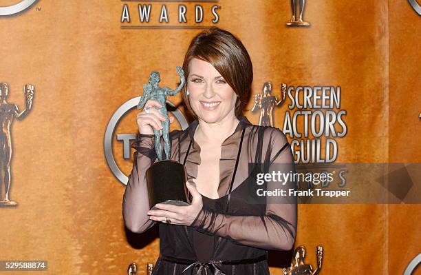 Megan Mullally in the press room with her award for Best Actress in a Comedy Series at the 10th Annual Screen Actors Guild Awards.