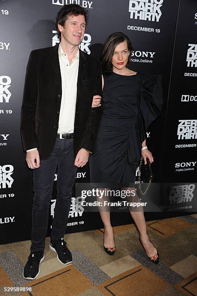 Actress Milla Jovovich and husband, producer Paul W.S. Anderson arrive at the premiere of Zero Dark Thirty held at the Dolby Theater in Hollywood.