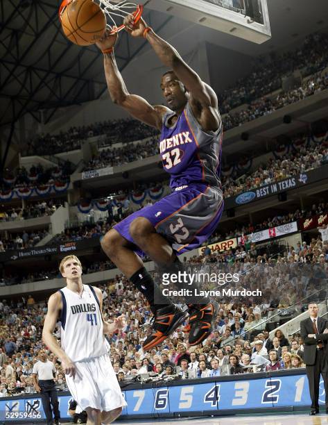 Amare Stoudemire of the Phoenix Suns dunks the ball in front of Dirk Nowitzki of the Dallas Mavericks in Game six of the Western Conference...