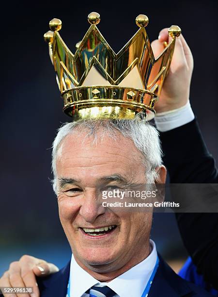 Claudio Ranieri Manager of Leicester City poses with the crown of the Premier League Trophy afterthe Barclays Premier League match between Leicester...