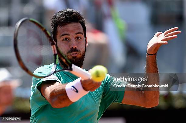 Salvatore Caruso of Italy plays a forehand in his match against Nick Kyrgios of Australia on Day Two of The Internazionali BNL d'Italia 2016 on May...