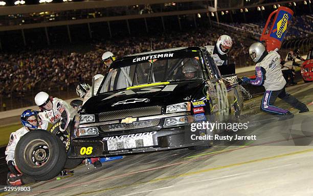 Butch Miller, driver of the ASI Limited/TSG/Seco Chevrolet, makes a pit stop during the NASCAR Craftsman Truck Series Quaker Steak and Lube 200 on...