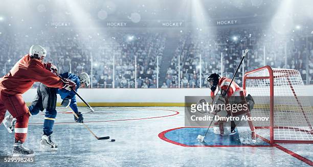 ice hockey players in action - professional hockey stock pictures, royalty-free photos & images
