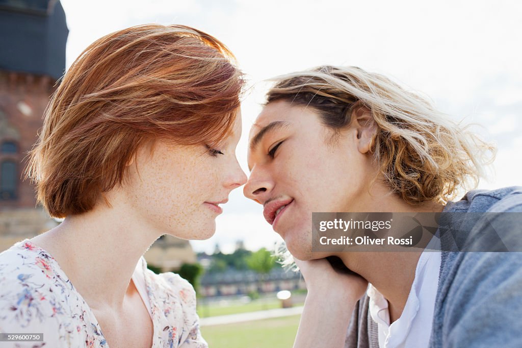 Teen (16-17) couple kissing