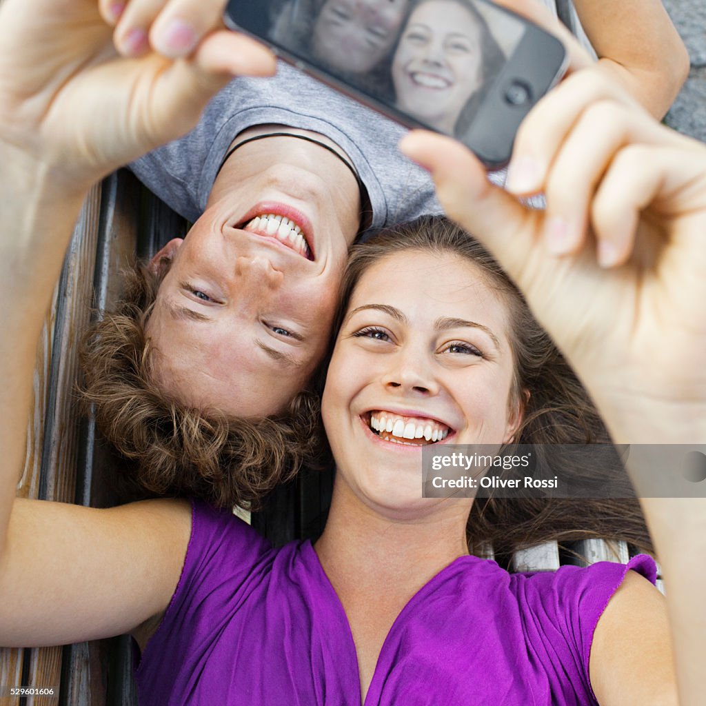 Teen (16-17) couple taking self-portrait photo