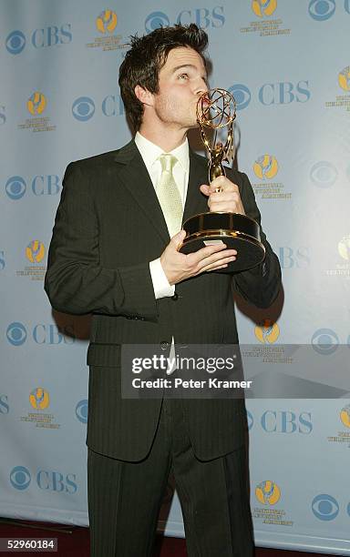 Actor Greg Rikaart poses with the award for outstanding supporting actor in the press room at the 32nd Annual Daytime Emmy Awards at Radio City Music...