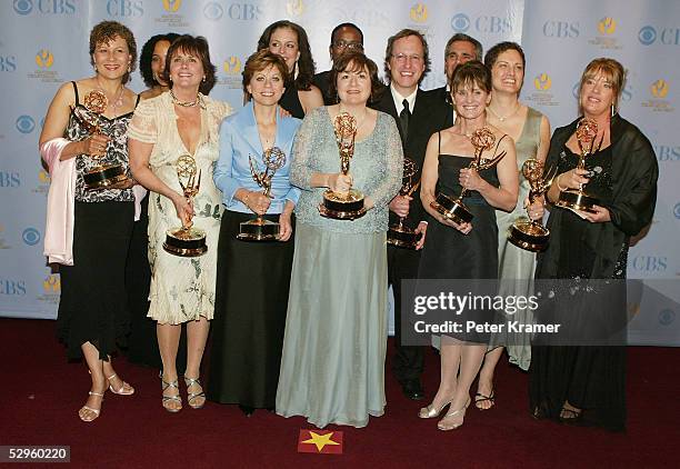 The writing team for As The World Turns pose with the award for outstanding drama series writing team in the press room at the 32nd Annual Daytime...