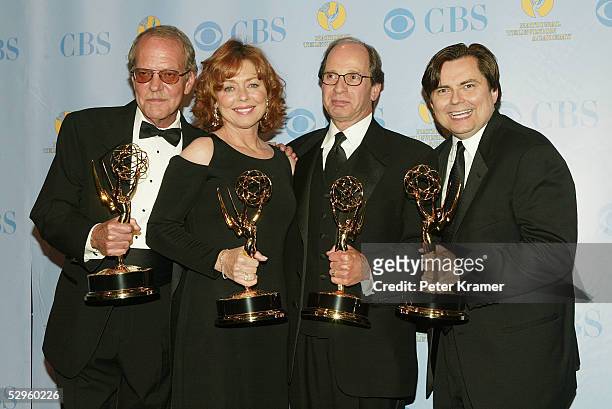 Producers of Jeopardy pose with the award for outstanding game/audience participation show in the press room at the 32nd Annual Daytime Emmy Awards...