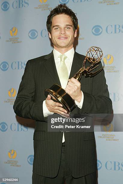 Actor Greg Rikaart poses with the award for outstanding supporting actor in the press room at the 32nd Annual Daytime Emmy Awards at Radio City Music...