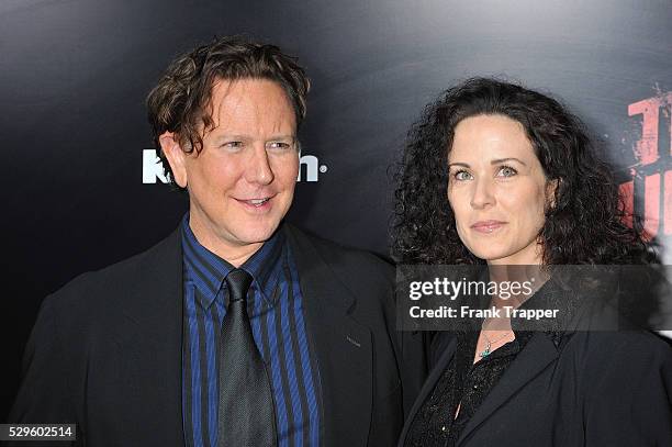 Actor Judge Reinhold and wife Amy arrive at the premiere of "The Runaways" held at the Cinerama Dome Theater.