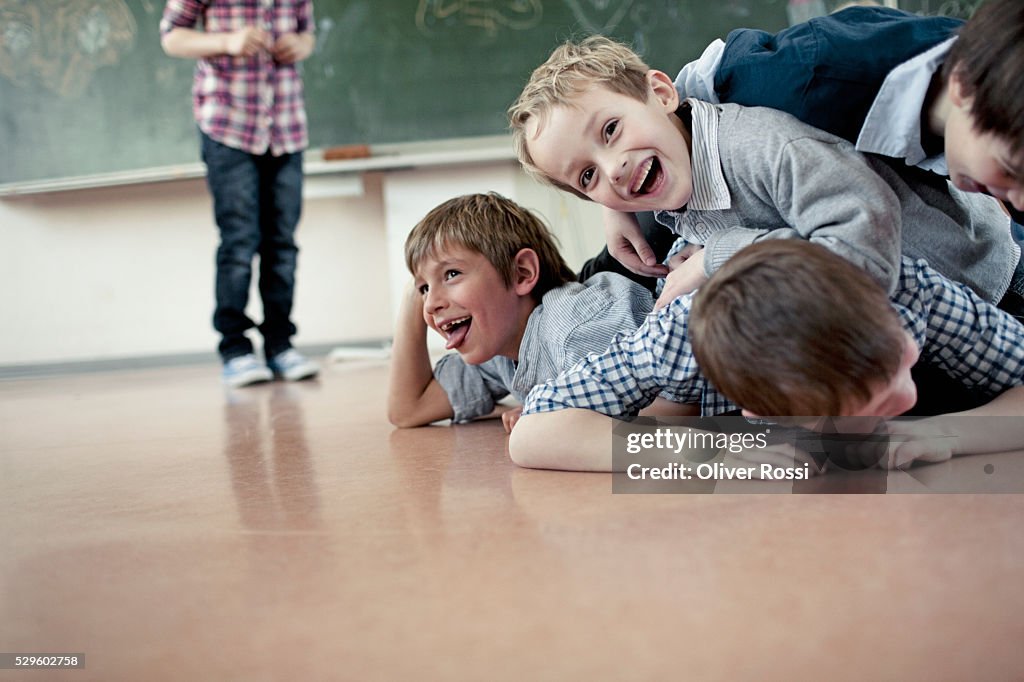 Group of schoolchildren (6-7) playing in classroom