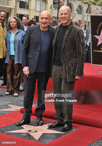 British actor Ben Kingsley posing with actor Bruce Willis after being honored with a Star on the Hollywood Walk of Fame.