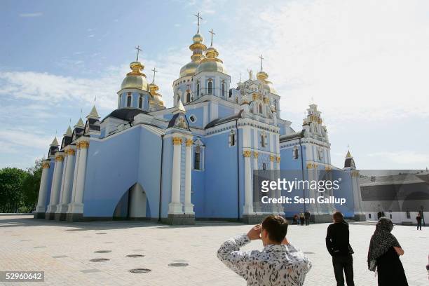 Vistors arrive at St. Michael's monastery May 18, 2005 in central Kiev, Ukraine. St. Michael's was destroyed in the 1930s under the Stalin regime and...