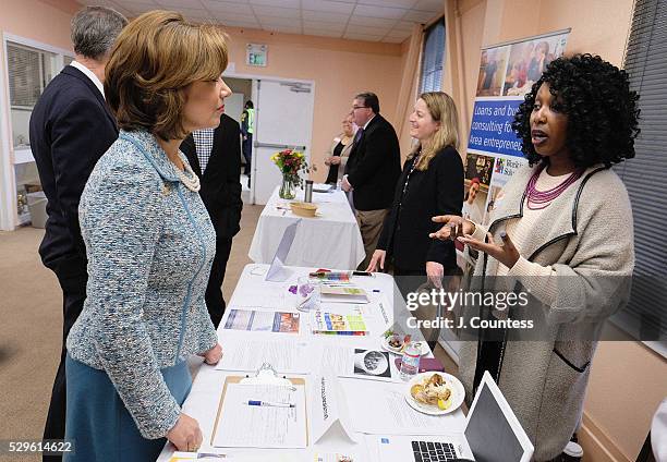 Administrator of the U.S. Small Business Administration Maria Contreras-Sweet speaks with project associate Brytanee Brown of the HOPE Collaborative...