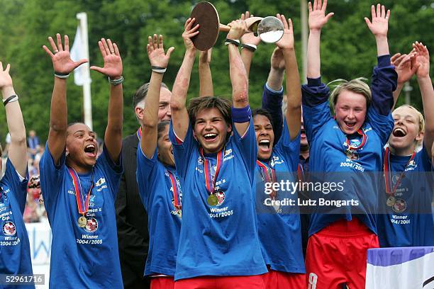 Ariane Hingst of Potsdam holds the Cup and the Team in the Background with Coach Bernd Schroeder after winning the Women UEFA Cup Final football...
