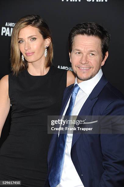 Actor Mark Wahlberg and wife Rhea Durham arrive at the premiere of Pain & Gain held at the Chinese Theater in Hollywood.