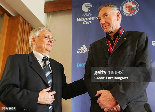 Dr. Theo Zwanziger DFB President, presents the DFB Needle awards to Bernd Schroeder coach of Turbine Potsdam after the Women UEFA Cup Final against...