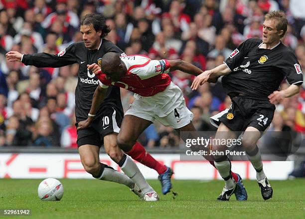 Ruud van Nistelrooy and Darren Fletcher of Manchester United clash with Patrick Vieira of Arsenal during the FA Cup Final match between Arsenal and...