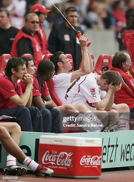 Heiko Gerber, Alexander Hleb, Cacao and Horst Heldt of Stuttgart sit on the bench after defeat in the 1. Bundesliga match between VfB Stuttgart and...