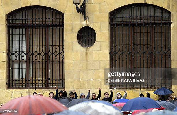 Group of young pro independence Basque nationalist supporters rise their fist as they sing "Eusko Gudaria" at the end of a political meeting after a...