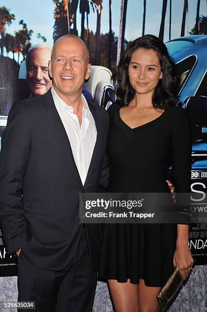 Actor Bruce Willis and wife Emma Heming arrive at the premiere of the HBO documentary "His Way" held at Paramount Studios in Hollywood.