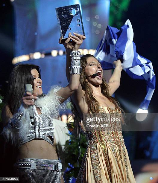 Singer Helena Paparaizou of Greece , winner of the 50th Eurovision Song Contest for her song, "My Number One", receives her award from Ruslana of...