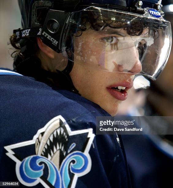 Sidney Crosby of the Rimouski Oceanic watches from the bench as his team plays the London Knights during the Memorial Cup Tournament at the John...