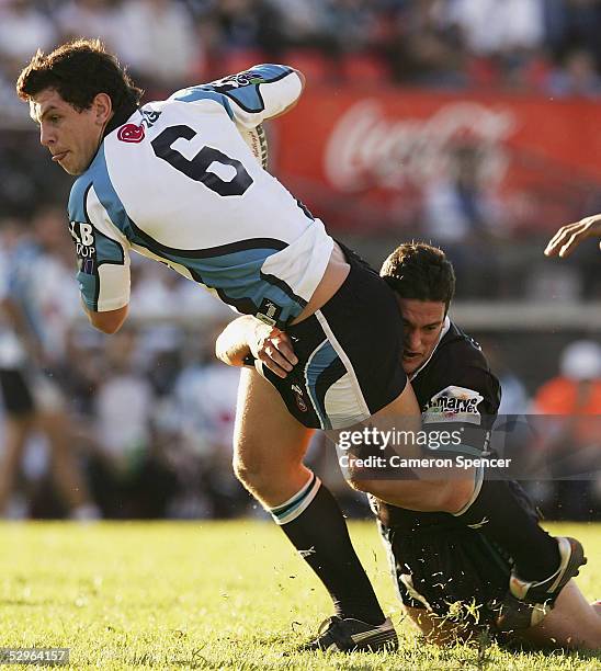 Greg Bird of the Sharks is tackled during the round 11 NRL match between the Penrith Panthers and the Cronulla-Sutherland Sharks at Penrith Stadium...