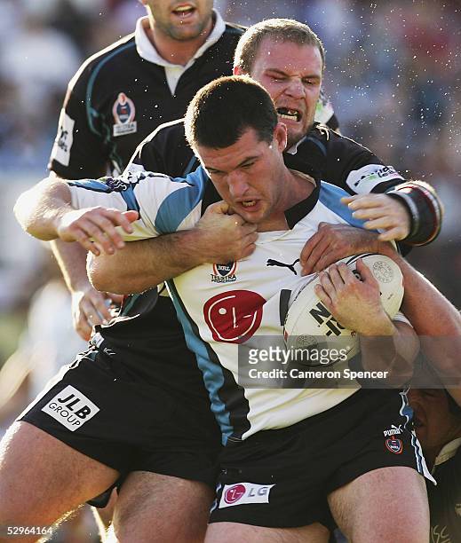 Paul Gallen of the Sharks is tackled during the round 11 NRL match between the Penrith Panthers and the Cronulla-Sutherland Sharks at Penrith Stadium...