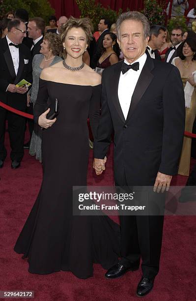 Annette Bening and husband Warren Beatty arrive at the 77th Annual Academy Awards�� at the Kodak Theatre. Bening's dress by Arm