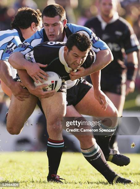 Craig Gower of the Panthers is tackled during the round 11 NRL match between the Penrith Panthers and the Cronulla-Sutherland Sharks at Penrith...