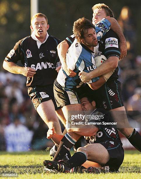 Phil Bailey of the Sharks is tackled during the round 11 NRL match between the Penrith Panthers and the Cronulla-Sutherland Sharks at Penrith Stadium...