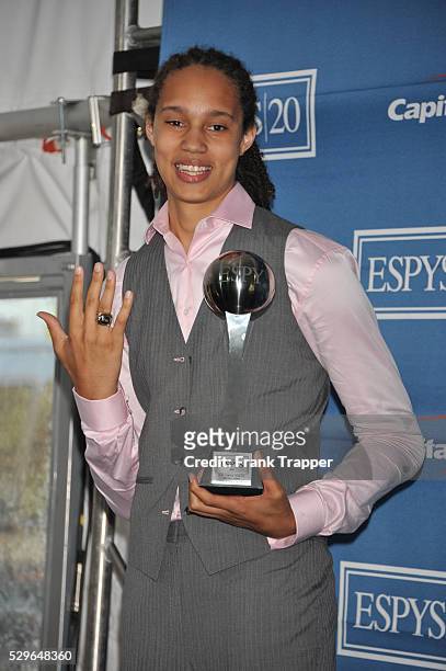 College basketball player Brittney Griner posing with the Best Female Athlete Award in the press room at the 2012 ESPY Awards at the Nokia Theatre...