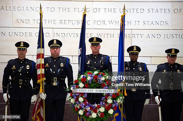 Wreath sits near the Capitol Police Honor Guard in the Capitol Visitor Center during a memorial service, May 9 for four officers killed in the line...