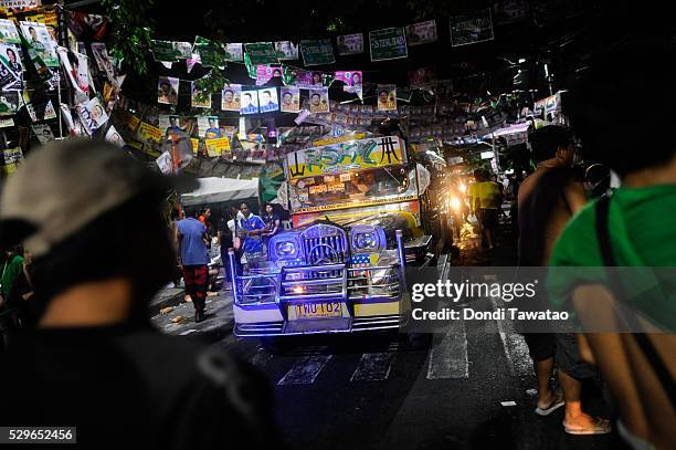 Jeepney passes through a polling precint after voting ended on May 9, 2016 in Manila, Philippines. Voters in the Philippines are set to elect Rodrigo...