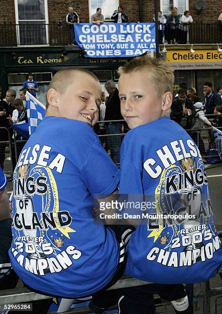 Chelsea fans wait for the team bus carrying the FA Barclays Premier League trophy and League Cup on the Chelsea Football Club victory parade on May...