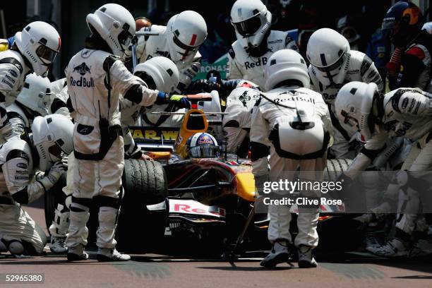 David Coulthard of Great Britain and Red Bull Racing makes a terminal pitstop as his pit-crew, dressed as stormtroopers, look on during the Monaco F1...