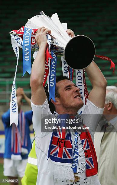 Barry Ferguson of Rangers lifts the Scottish Premier League Trophy after the Bank of Scotland Scottish Premier League match between Hibernian and...