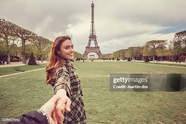 attractive woman sightseeing paris with her boyfriend - following bildbanksfoton och bilder