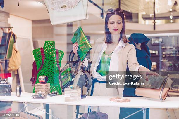 window-dresser - designer bag stock pictures, royalty-free photos & images