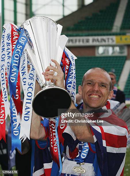 Alex Rae of Rangers lifts the Scottish Premier League trophy during the Bank of Scotland Scottish Premier League match between Hibernian and Rangers...