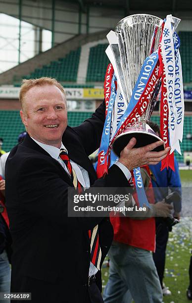 Manager Alex McLeish of Rangers lifts the Scottish Premier League trophy during the Bank of Scotland Scottish Premier League match between Hibernian...