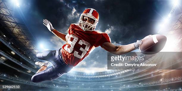 football player catches a ball - touchdown stock pictures, royalty-free photos & images