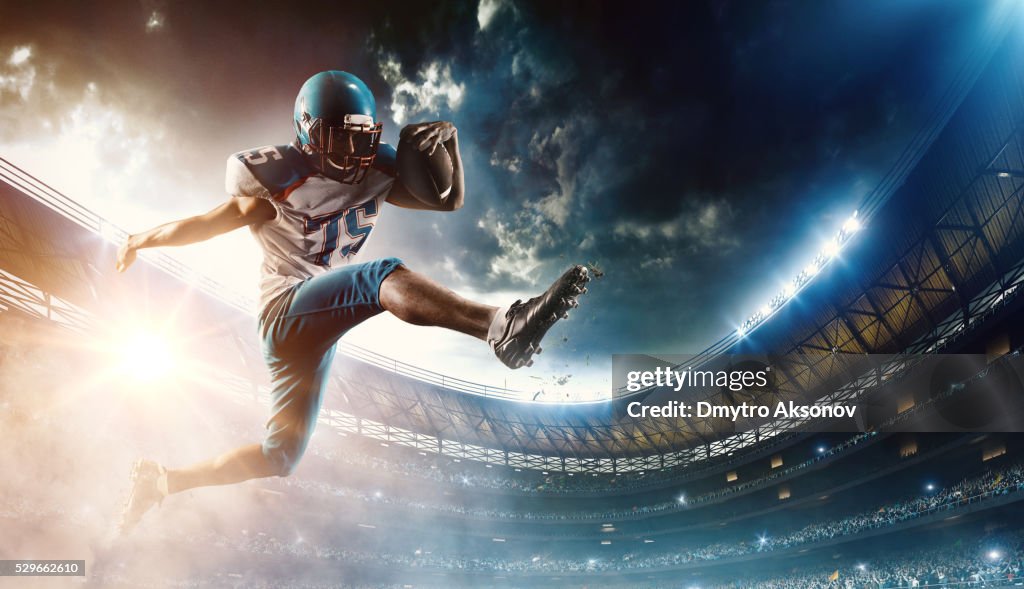 Football player runs with the ball